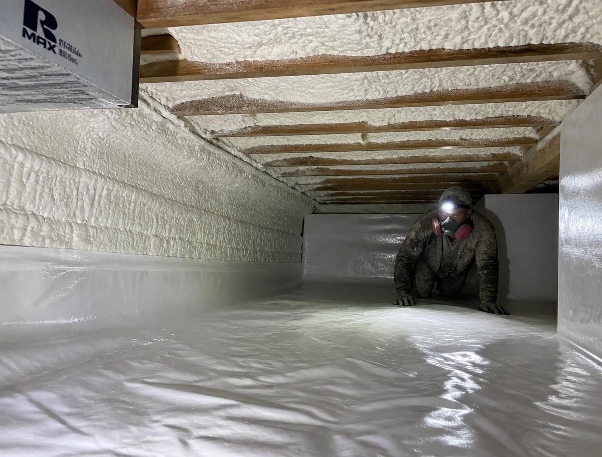 Encapsulated crawl space with new spray foam insulation and vapor barrier