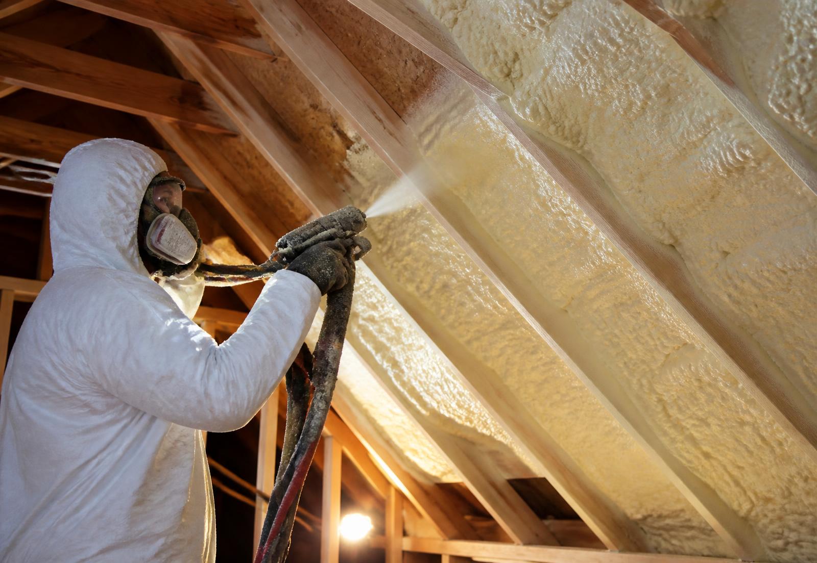 Stellrr installer applying spray foam insulation to an Austin attic roof deck